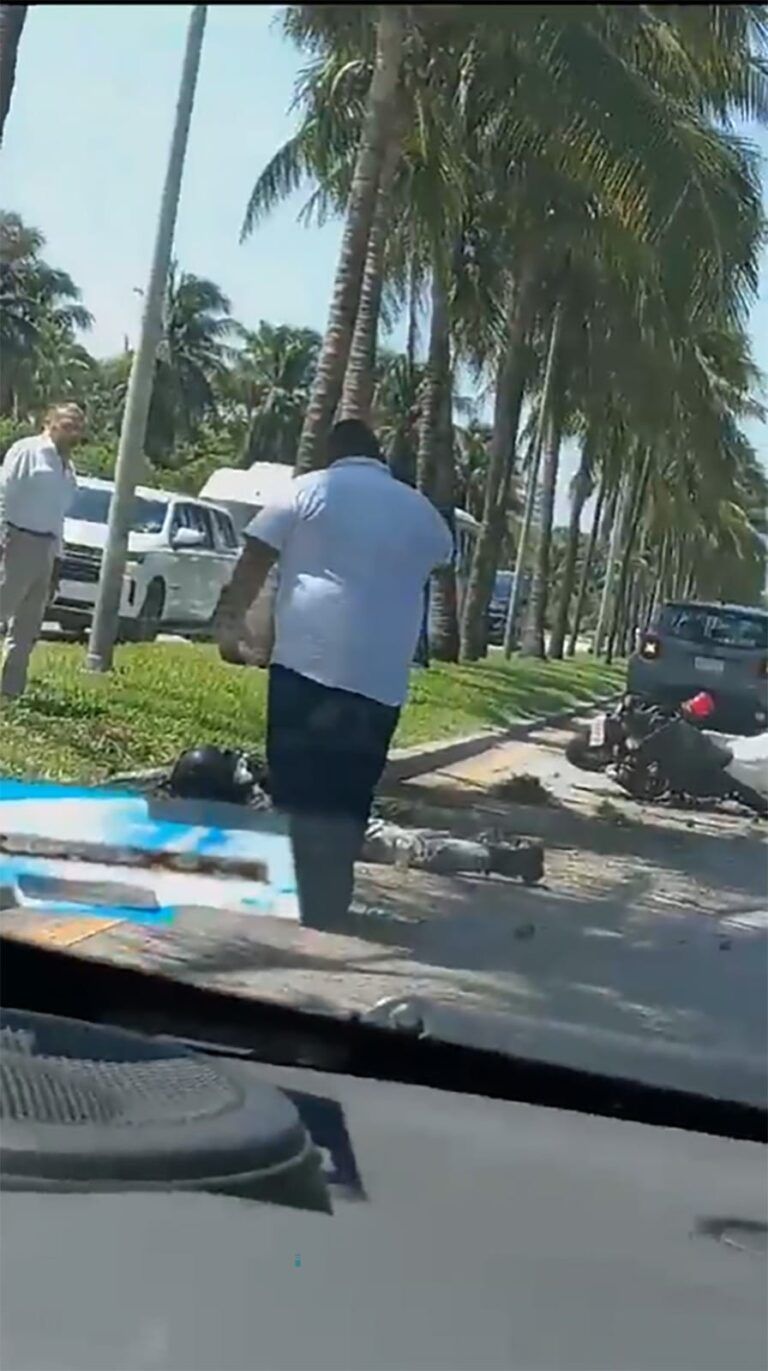 Dos elementos de la Guardia Nacional derrapan en moto en la zona hotelera de Cancún